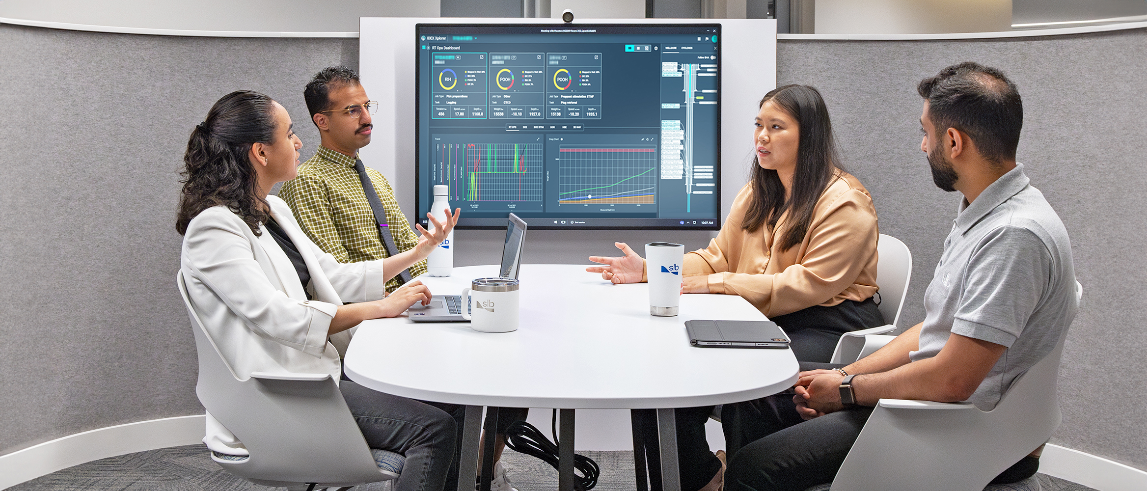 SLB employees discuss IDEX collaboration platform.