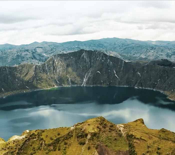 A mountain range and lake in Ecuador