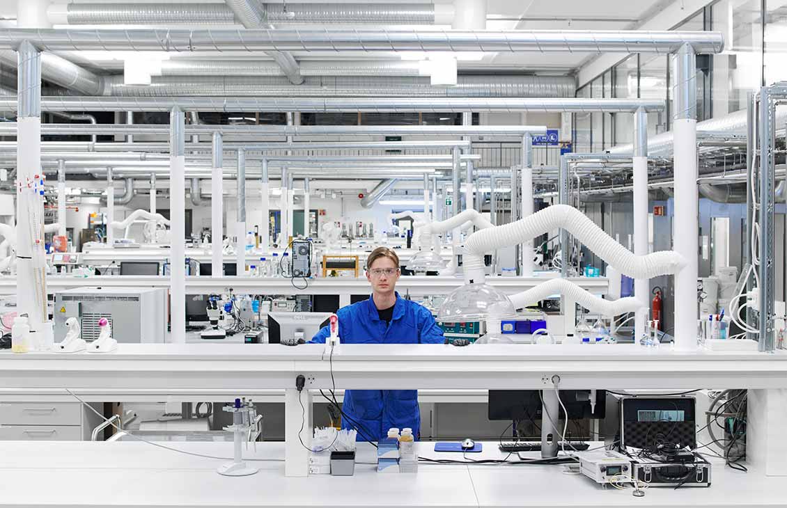 A SLB employee standing in a testing facility