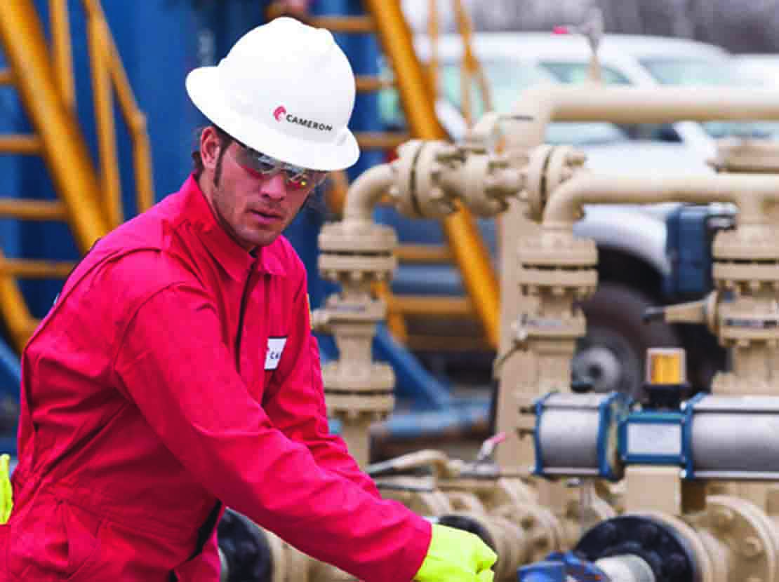 Cameron employee in front of a valve.