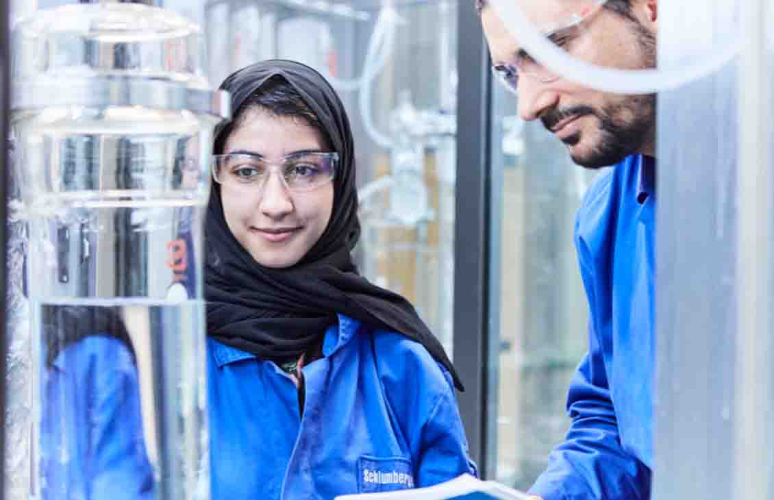 Person in PPE in laboratory environment.