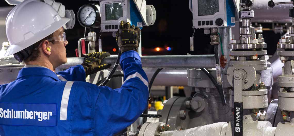 Worker testing equipment at water treatment facility