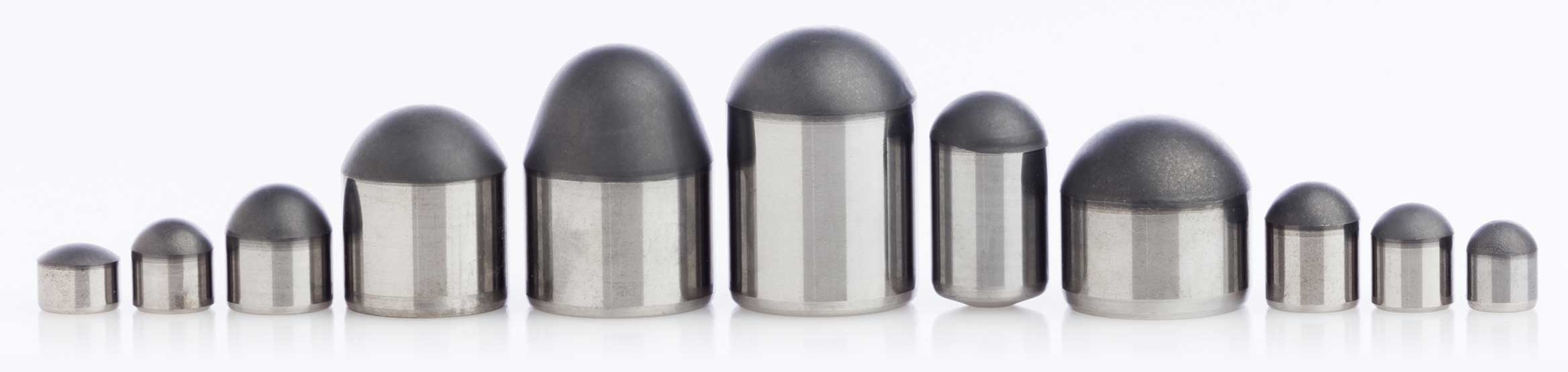 Wide range of diamond buttons and diamond dome inserts shown for use in the mining industry.
