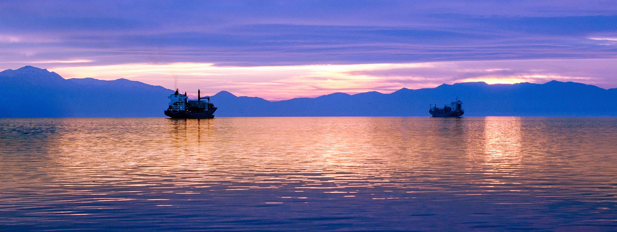 Photo of a North Sea offshore platform at sunset.
