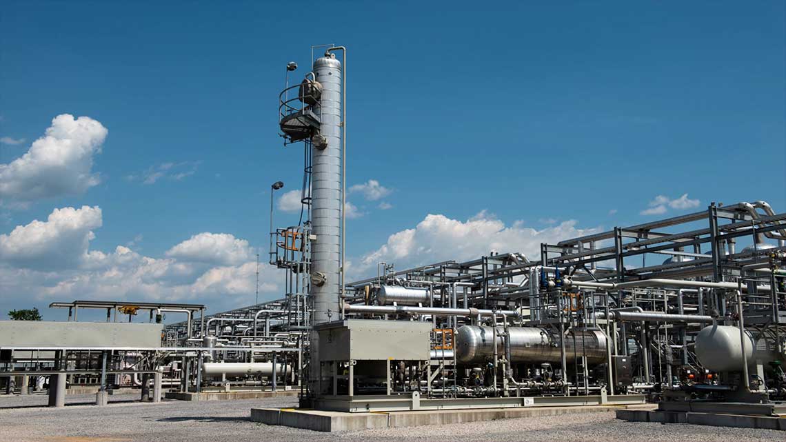 Processing plant with a blue sky