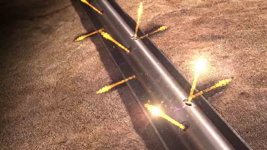 Perforating guns firing into the formation.